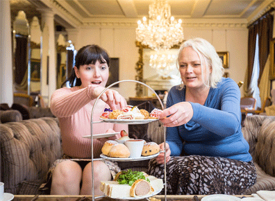 Afternoon tea in front of the fire at Chilston Park Hotel