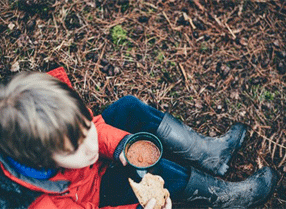 Boy with bread and soup