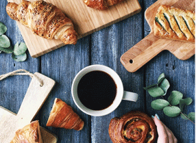 Coffee cup and pastries