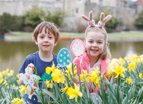Easter at Leeds Castle two children in the daffodils