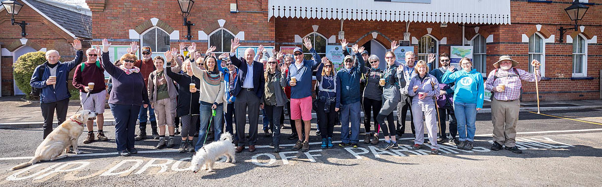 Walking Festival Attendees smiling and waving