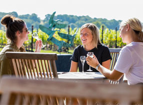 Three ladies enjoying wine at Hush Heath