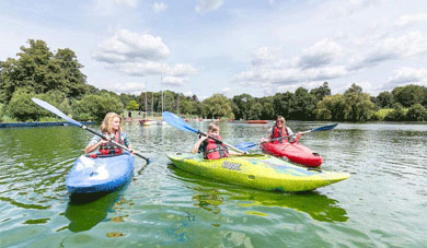 three people on canoes